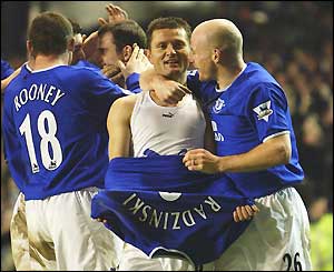 Tomasz Radzinski (centre) is congratulated after equalising for Everton