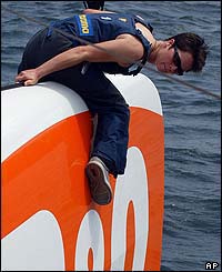 Ellen MacArthur sits on the bow of her new boat