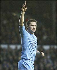 Robbie Keane salutes the Spurs fans after scoring the winner