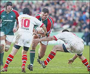 England captain Martin Johnson is challenged by David Humphreys and Andy Ward