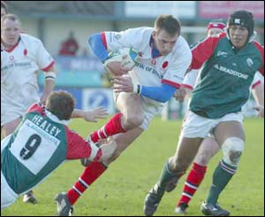 Ulster flanker Neil Best goes past Austin Healy
