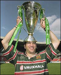 Leicester captain Martin Johnson holds the trophy aloft after the Heineken Cup Final win over Stade Francais