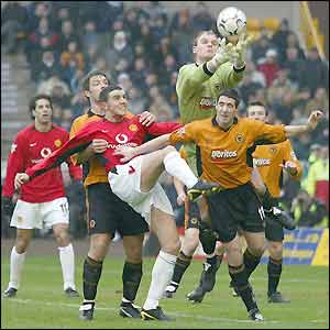 Wolves keeper Michael Oakes claims a cross at Molineux