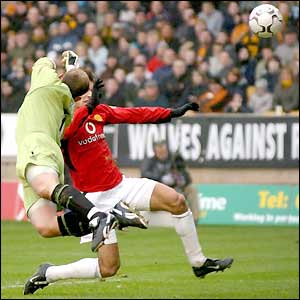 Wolves keeper Michael Oakes palms away a Man Utd free-kick
