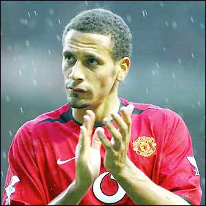 Rio Ferdinand applauds the travelling United support