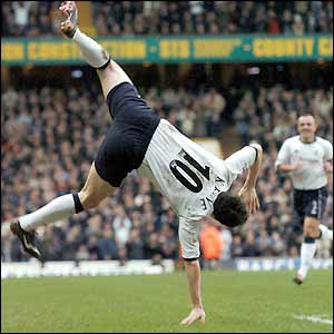 Spurs striker Robbie Keane celebrates scoring his spot kick
