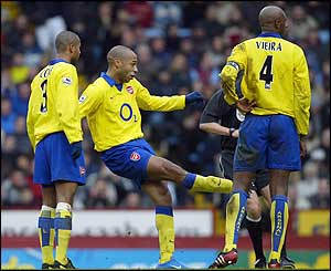 Thierry Henry controversially puts the visitors ahead on 28 minutes with a smartly-taken free-kick