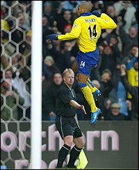 Thierry Henry leaps in the air after scoring his and Arsenal's second goal