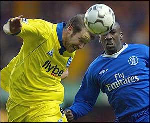 Kenny Cunningham of Birmingham gets to the ball in front of Chelsea's Jimmy Floyd Hasselbaink
