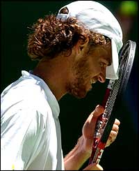 Gustavo Kuerten rues a lost point in his win over John Van Lottum 