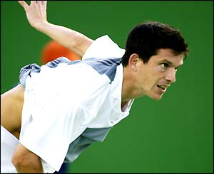 Tim Henman serves