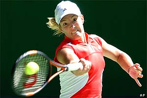 Women's top seed Justine Henin-Hardenne fires a forehand on her way to victory over Camille Pin