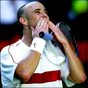Andre Agassi blows a kiss to the corwd