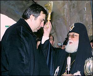 Mikhail Saakashvili receives a blessing from Ilya Il, head of Georgia's Orthodox Church