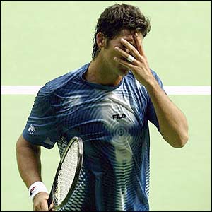 Mark Philippoussis is knocked out of the Australian Open by Hicham Arazi