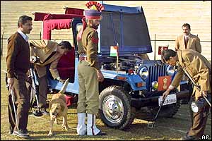 Sniffer dogs and bomb-experts inspect a jeep in Jammu
