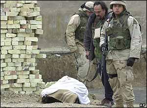 Security personnel with stretcher after Baghdad bomb blast