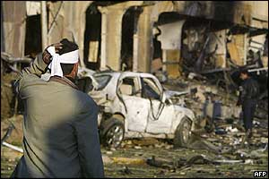 Wounded Iraqi outside bombed hotel