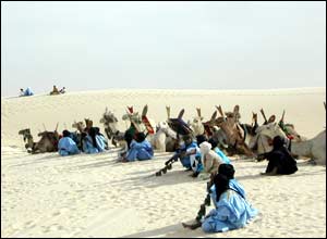 Camels and Tuareg nomads wait for the start of the festival