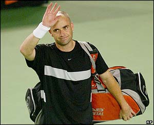 Andre Agassi waves to the crowd