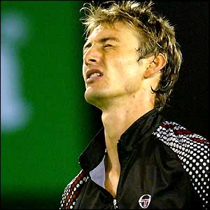 Juan Carlos Ferrero grimaces in anguish