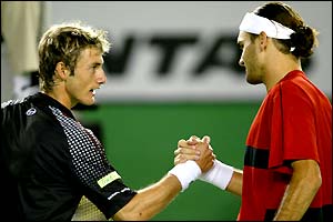 Juan Carlos Ferrero and Roger Federer shake hands at the end of the match