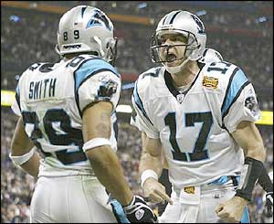 Quarterback Jake Delhomme #17 of the Carolina Panthers celebrates with Steve Smith #89 after Smith caught a 5-yard touchdown pass in the second quarter during Super Bowl XXXVIII 