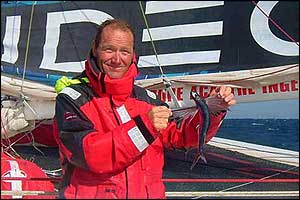 A self-portrait of Joyon holding a flying fish