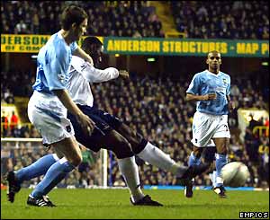 Ledley King strikes the ball to score Tottenham's opening goal
