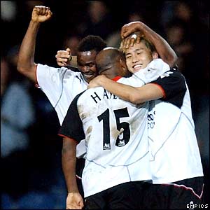 Junichi Inamoto (right) is congratualted by his team mates