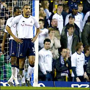 Dean Richards and the SPurs faithful look dejected after losing to Man City