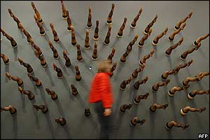 Woman passes exhibit in show