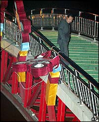 Official examines broken railing