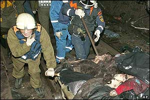 Emergency workers remove bodies of victims 