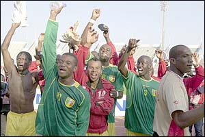Mali's players celebrate victory over Guinea