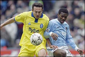 Birmingham's Stan Lazaridis battles with Shaun Wright-Phillips of Manchester City 