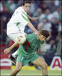 Algeria's Kraouche Nasredine struggles with Morocco's opponent Zairi Jouad 