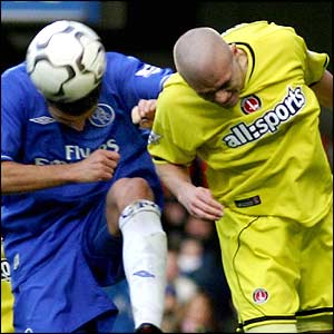 Paul Konchesky of Charlton tries to get the ball away from Adrian Mutu