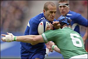 French fly-half Frederic Michalak is tackled by Ireland's Simon Easterby