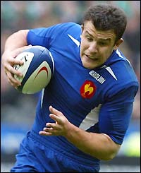 Damien Traille breaks through a tackle from Ronan O'Gara