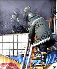 Firefighters enter burning building