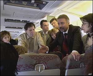 Prime Minister Branko Crvenkovski talks to journalist on his return flight