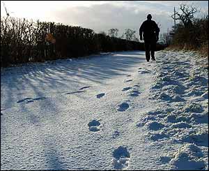 Man walks in snow