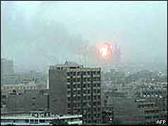Baghdad with scene of explosion on horizon