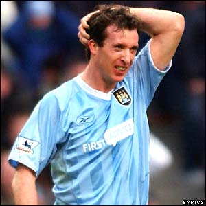 Robbie Fowler looks in anguish as Man City miss a chance