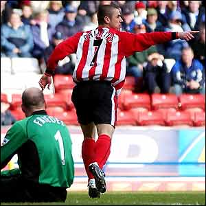 Kevin Phillips wheels away after scoring past Brad Friedel