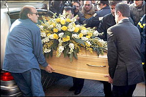 Marco Pantani's coffin arrives at Cesenatico's tiny church, where he was laid to rest on Wednesday