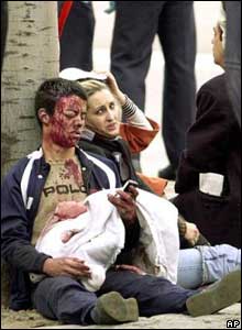 Two people injured by an explosion in a train wait for aid 