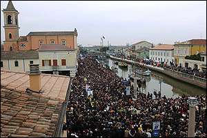 Thousands of mourners gather outside the church as Pantani's coffin is carried to his funeral