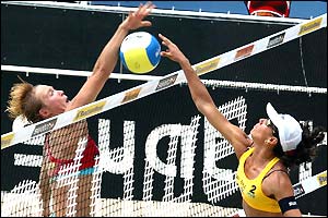 Germany's Claasen Deister attempts to block a spike from Ana Paula-Sandra Pires of Brazil